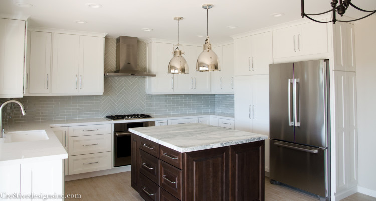 Kitchen remodel with quartz countertops and a honed marble island