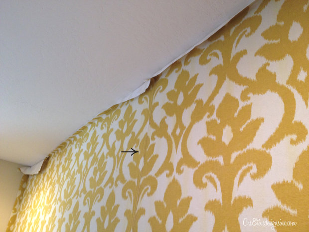Overlapping seams on hanging fabric on a wall