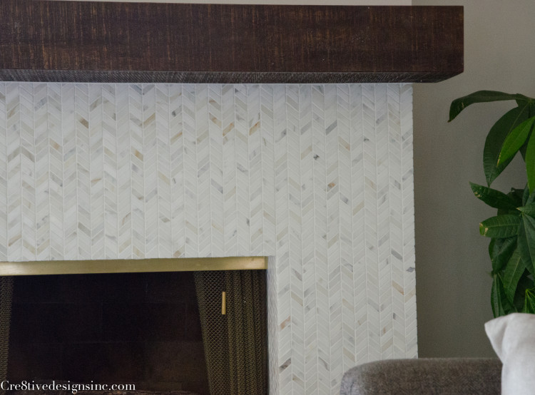 calcutta marble chevron fireplace surround