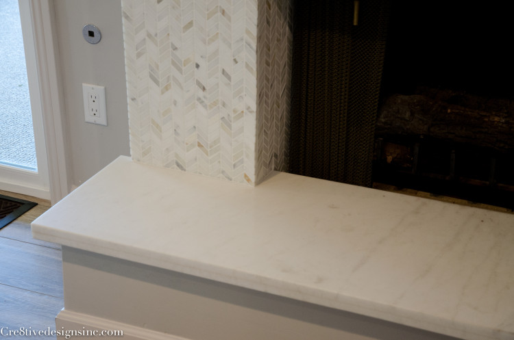 fireplace remodel with calcutta marble hearth